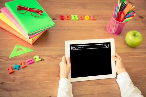 Child holding tablet PC in hands — Stock Photo, Image