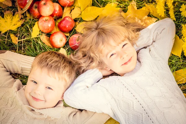 Children in autumn park — Stock Photo, Image