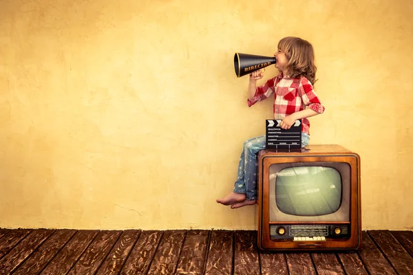 Kid shouting through vintage megaphone. — Stock Photo, Image