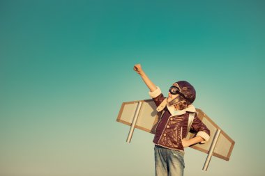 Happy child playing with toy airplane clipart