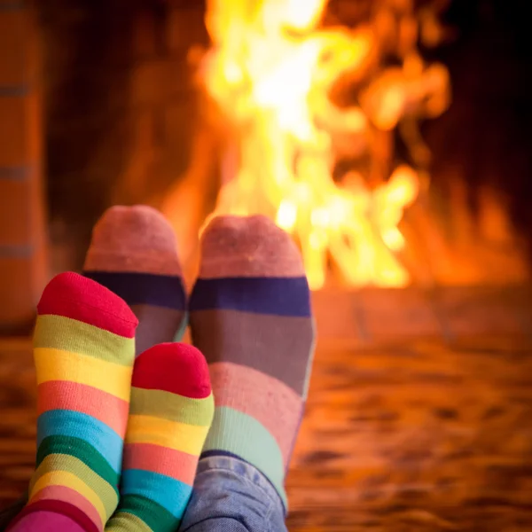 Father and kid near fireplace — Stock Photo, Image