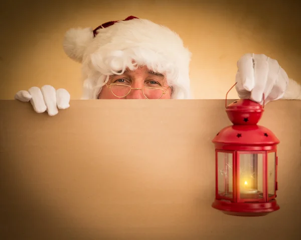 Papai Noel segurando lanterna mágica — Fotografia de Stock