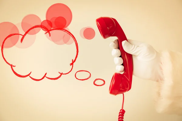 Santa Claus holding retro phone — Stock Photo, Image