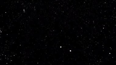 Uzayda siyah arkaplanda kar.