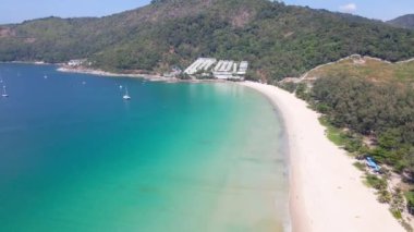 High angle view Aerial view. Scene of  Beach sea sand and cityscape at beach in sunny summer day. Mountain and sky with cloud background, At Karon Beach, Phuket, Thailand. On 20 Jan, 2021
