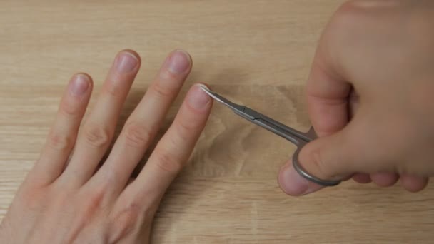 Man Cuts Nails Closeup — Stock Video