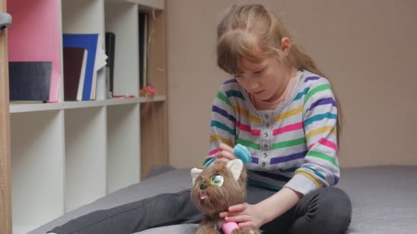 Girl Combing A Toy — Stock Video