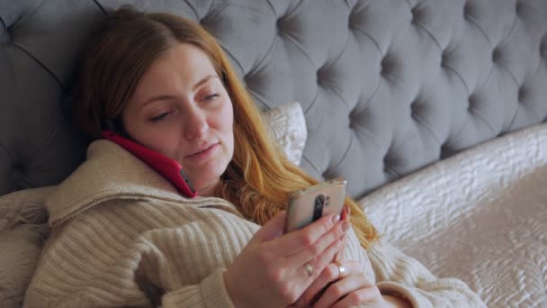 Woman With Two Smartphones Closeup — Stockvideo