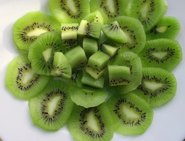 Kiwi fruit on a white plate — Stock Photo, Image