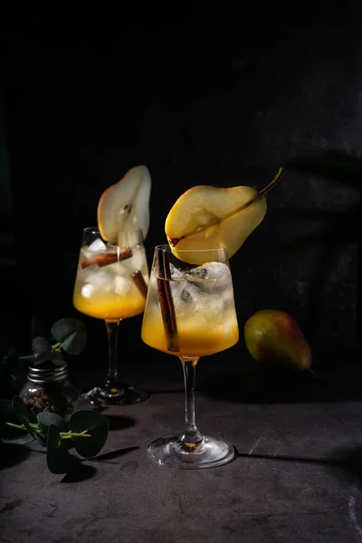 Refreshing cocktail with pear and syrup Stock Photo