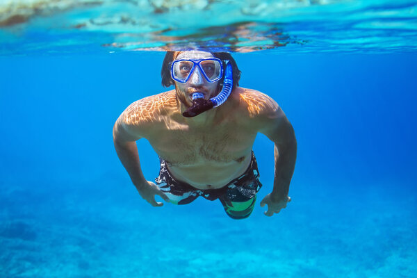 young man snorkeling