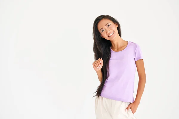 Pretty smiling asian woman in casual clothes posing looking to camera with copy space — Stock Photo, Image