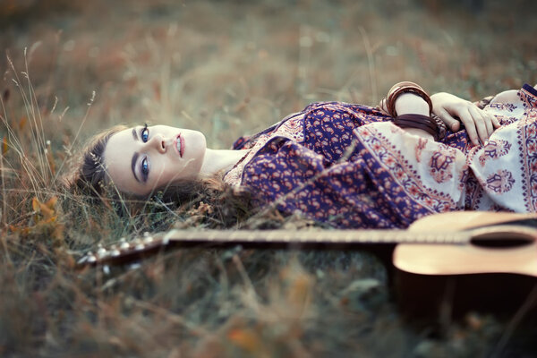 hippie girl with guitar