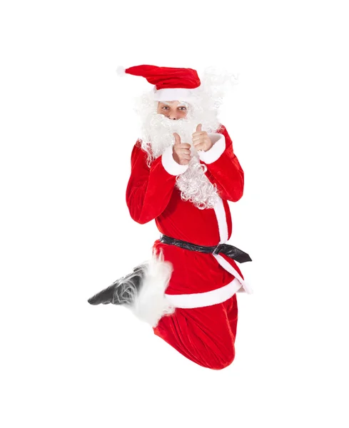 Santa claus skoki z kciuk znak — Zdjęcie stockowe