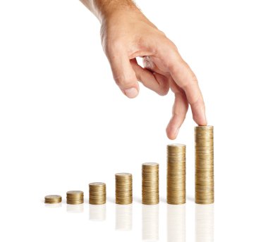 Hand and stacks of coins