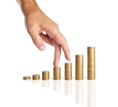 Hand and stacks of coins