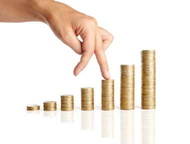 Hand and stacks of coins