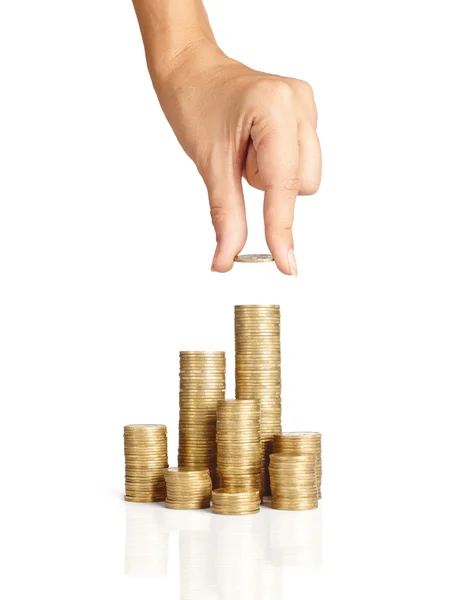 Hand put coins to stack of coins — Stock Photo, Image