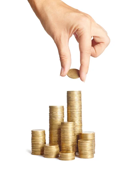 Hand put coins to stack of coins — Stock Photo, Image