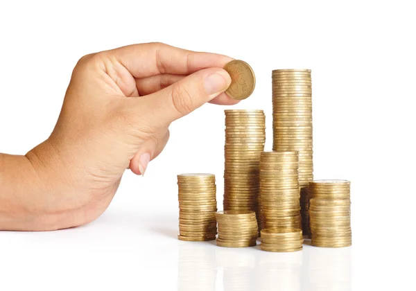 Hand put coins to stack of coins — Stock Photo, Image