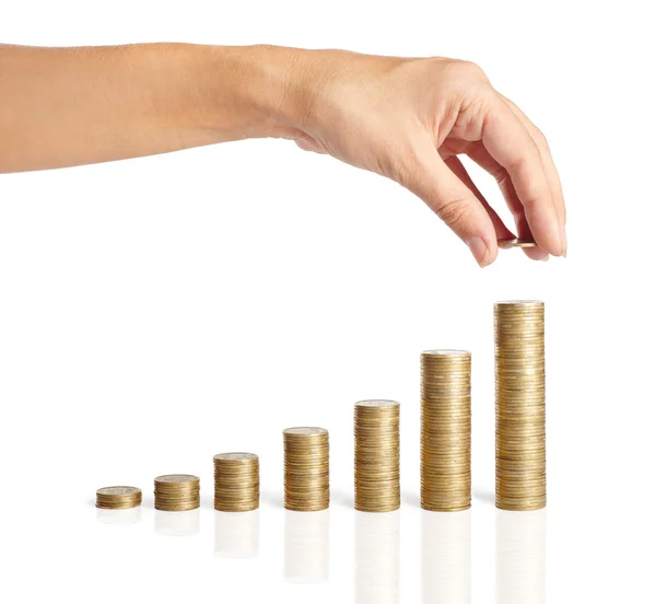 Hand put coins to stack of coins — Stock Photo, Image