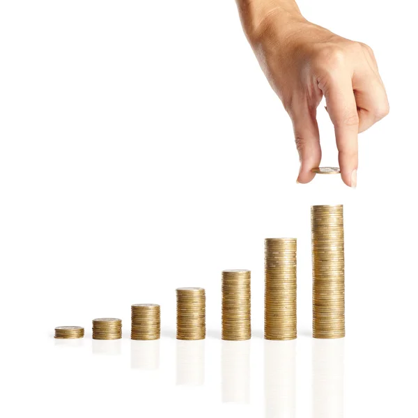 Hand put coins to stack of coins — Stock Photo, Image