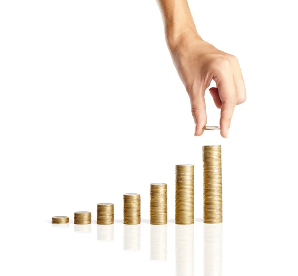 Hand put coins to stack of coins — Stock Photo, Image