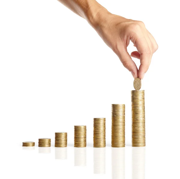 Hand put coins to stack of coins — Stock Photo, Image