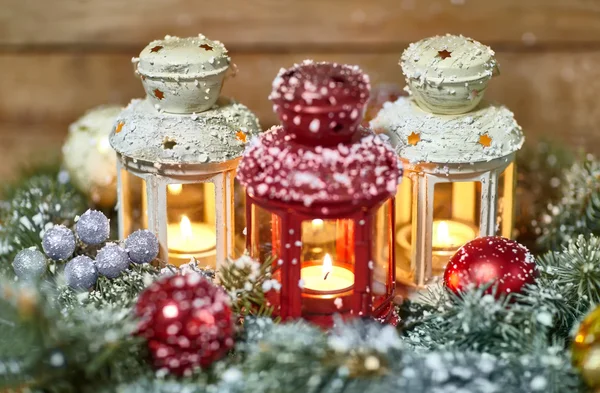 Lanterns, baubles and fir in snow — Stock Photo, Image