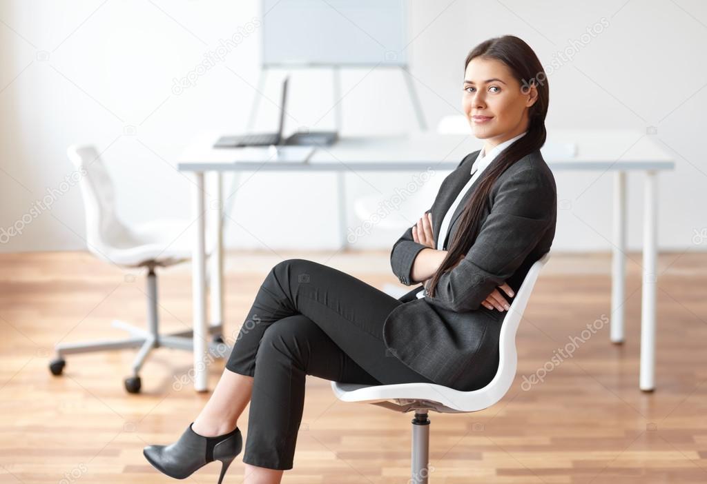 business woman sitting on chair in the office