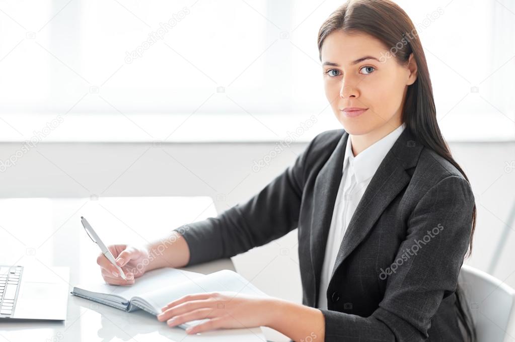 businesswoman with documents in office