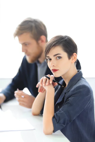 Businesswoman and businessman working in office — Stock Photo, Image