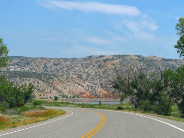 Winding road along the Wyoming landscape. clipart