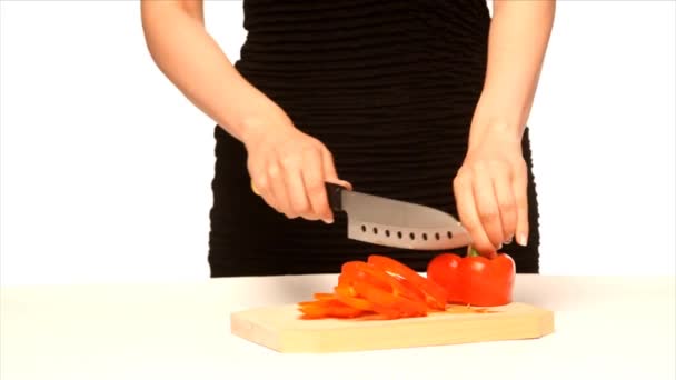 Girl chopping red pepper — ストック動画