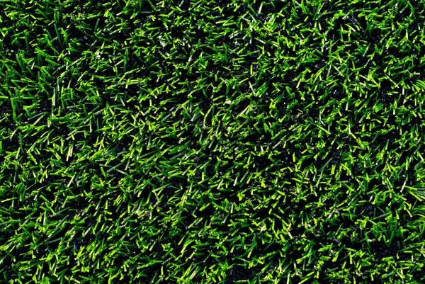 サッカー場の質感を閉じます スタジアムの草 スポーツ場のための素晴らしい芝生 — ストック写真