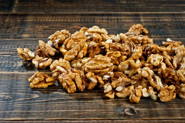 Walnut Texture Close Many Halves Peeled Nuts Old Wooden Board — Stock Photo, Image