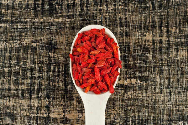 Red Goji Berries Wooden Spoon Spices Seasonings Old Shabby Board — Stock Photo, Image