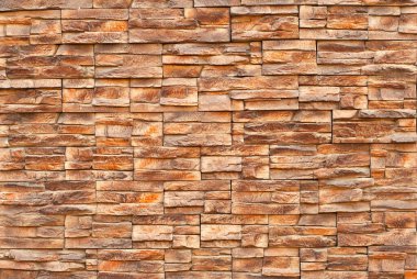 Tuğla duvar ve beton bloklar. Sıraya dizilmiş taş levha örnekleri.