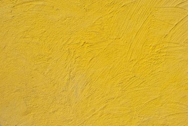 Sarı duvarda alçı var. Beton duvar dokusu kapat.