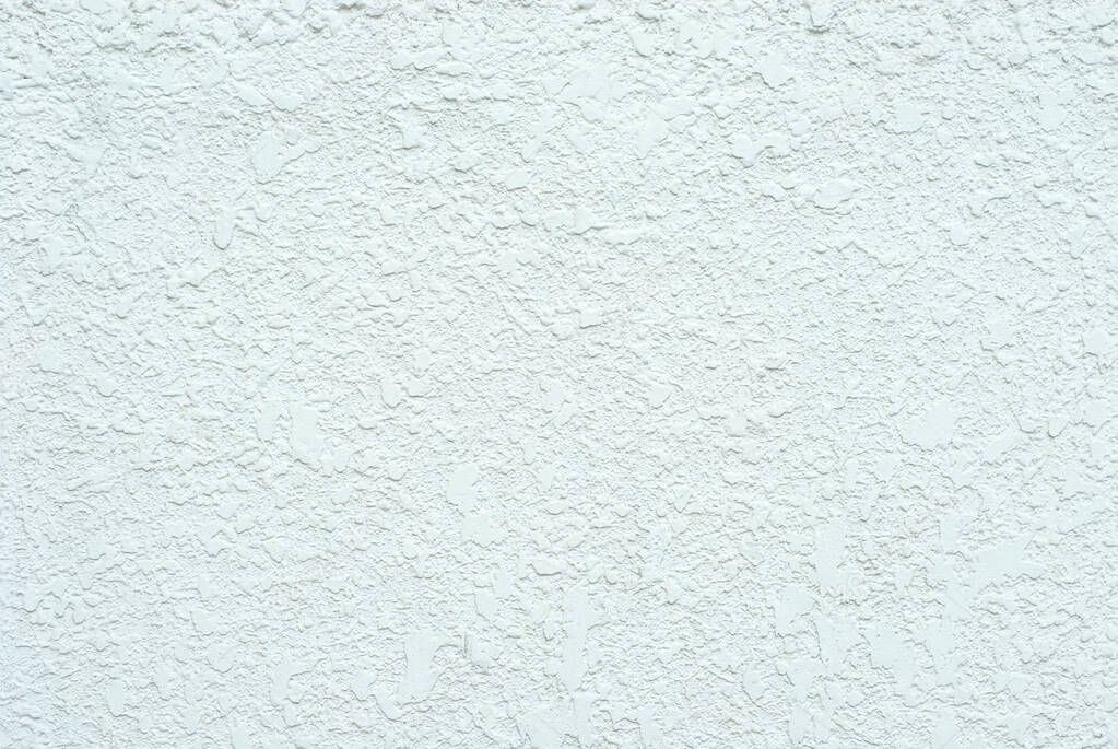 Plaster on a blue wall. Concrete wall texture close up.