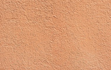 Sarı duvarda alçı var. Beton duvar dokusu kapat.