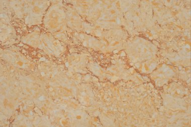 Sarı ve turuncu mermer dokusu. Doğal desenli taş döşeme. Mermer kaldırım, yakın plan..