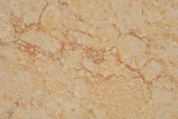Sarı ve turuncu mermer dokusu. Doğal desenli taş döşeme. Mermer kaldırım, yakın plan..