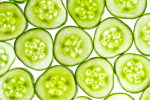 Cucumbers Section White Background Pieces Cucumber Illuminated Light Texture Sliced — Stock Photo, Image