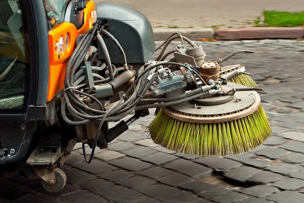 Cleaning machine element. Brushes and wheels close up. Cleaning dirty pavement.