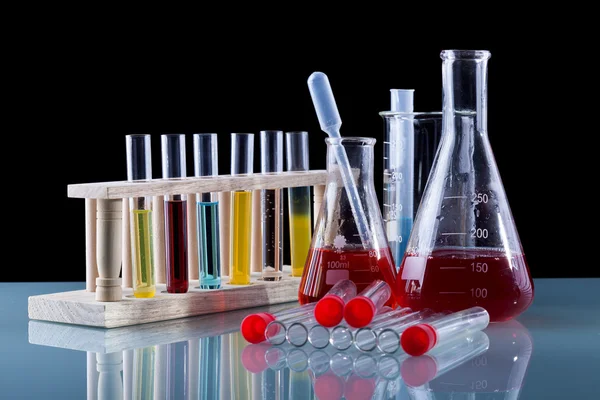 Chemistry class utensils on glass table — Stock Photo, Image