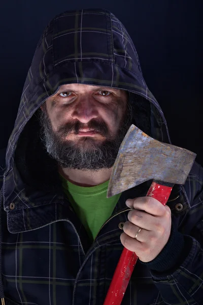 Hooded tough guy holding axe — Stock Photo, Image