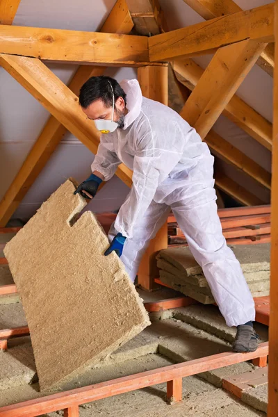 Man laying thermal insulation layer — Stock Photo, Image