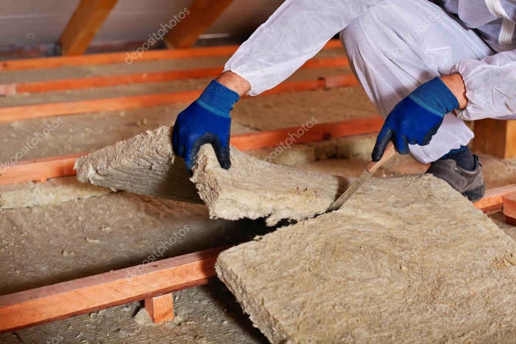 Installing thermal insulation layer closeup on hands — Stock Photo