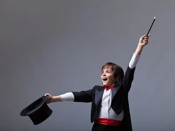 Young magician performing a trick — Stock Photo, Image